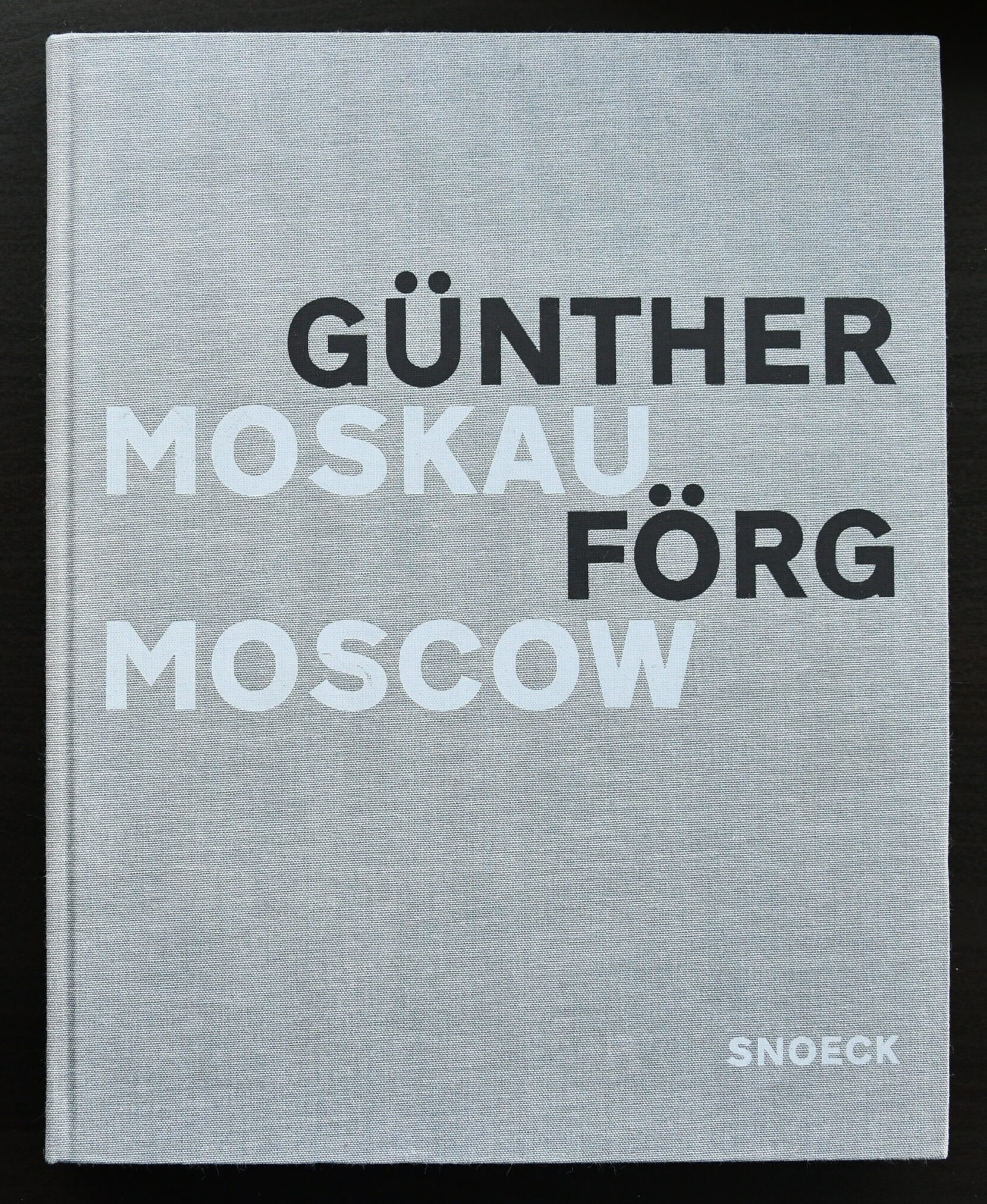A hardcover art book titled 'Günther Förg Moscow' with a grey cover and bold black and white text.