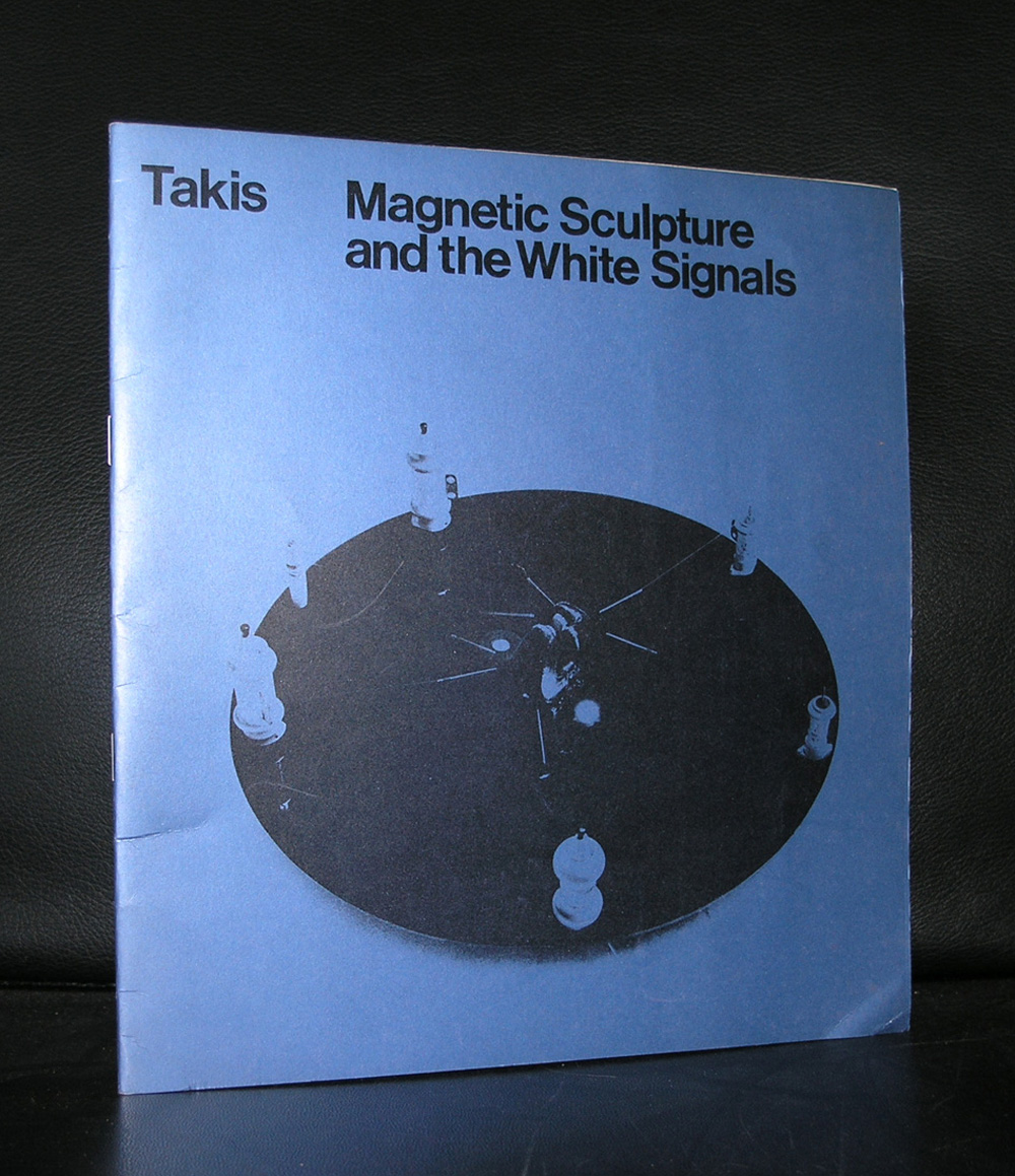 Cover of a publication titled 'Magnetic Sculpture and the White Signals' by artist Takis, featuring a blue background and an image of a sculpture with white elements.