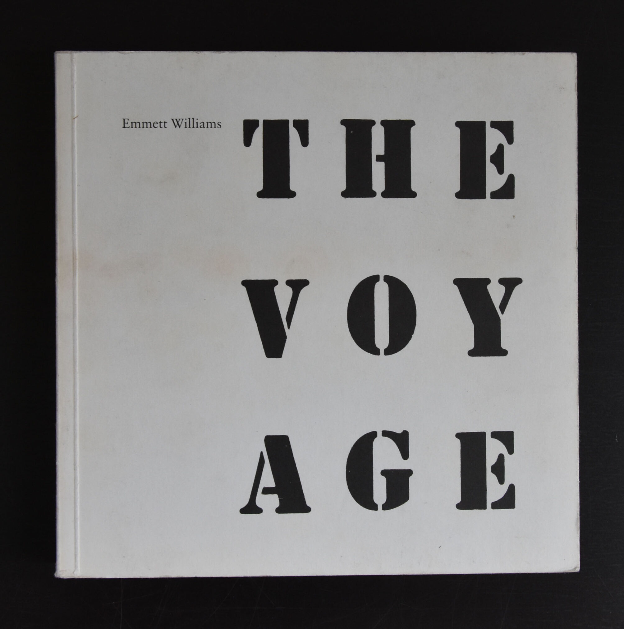 Cover of the book 'The Voyage' by Emmett Williams, featuring bold black letters on a white background.